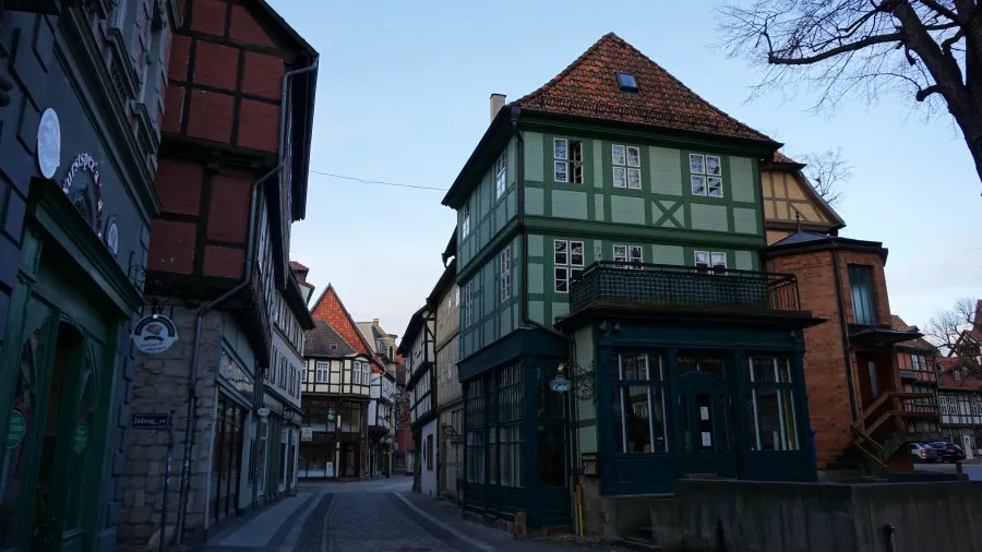 Historic street scene featuring traditional German half-timbered houses in a quaint village.