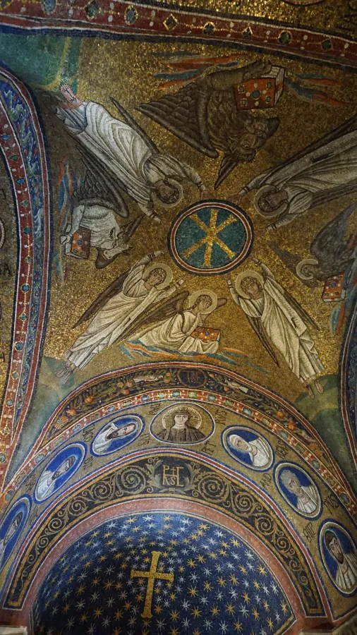 Golden Byzantine mosaic ceiling with angels, medallions of saints, and a starry cross-centered dome.