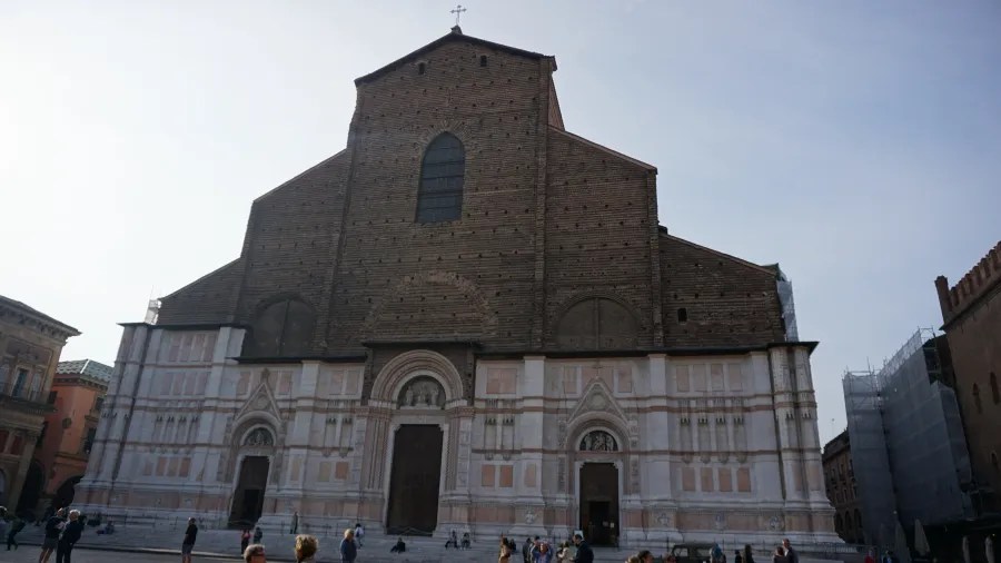The unfinished brick and marble facade of the Basilica of San Petronio in Bologna