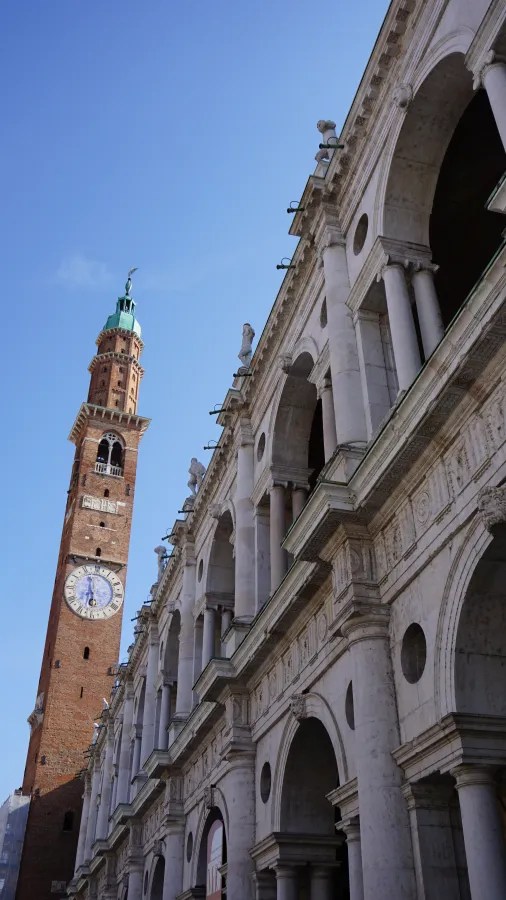 The Basilica Palladiana and the Torre Bissara clock tower in Vicenza, Italy.