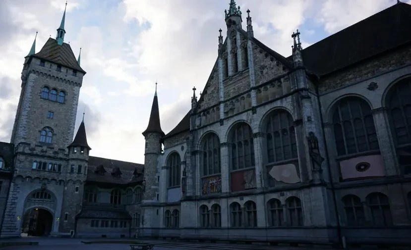 Stone towers and ornate facade of the Swiss National Museum building in Zurich.