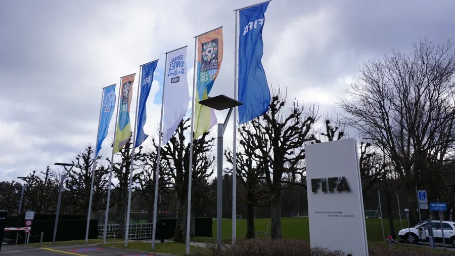 FIFA sign and flags including Football Unites the World and FIFA Women's World Cup AU NZ 2023.