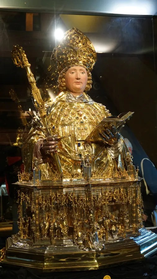 Ornate golden reliquary bust of a bishop wearing a miter and holding a crozier.